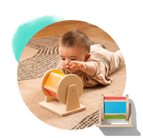 Baby spinning the Spinning Rainbow from The Senser Play Kit