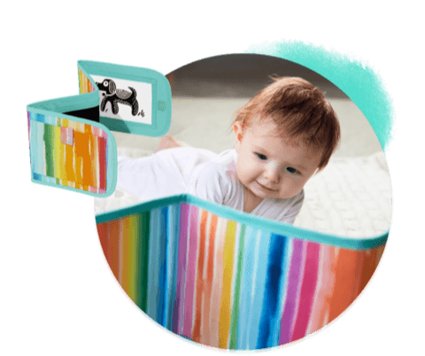 Baby looking at the Standing Card Holder from The Looker Play Kit